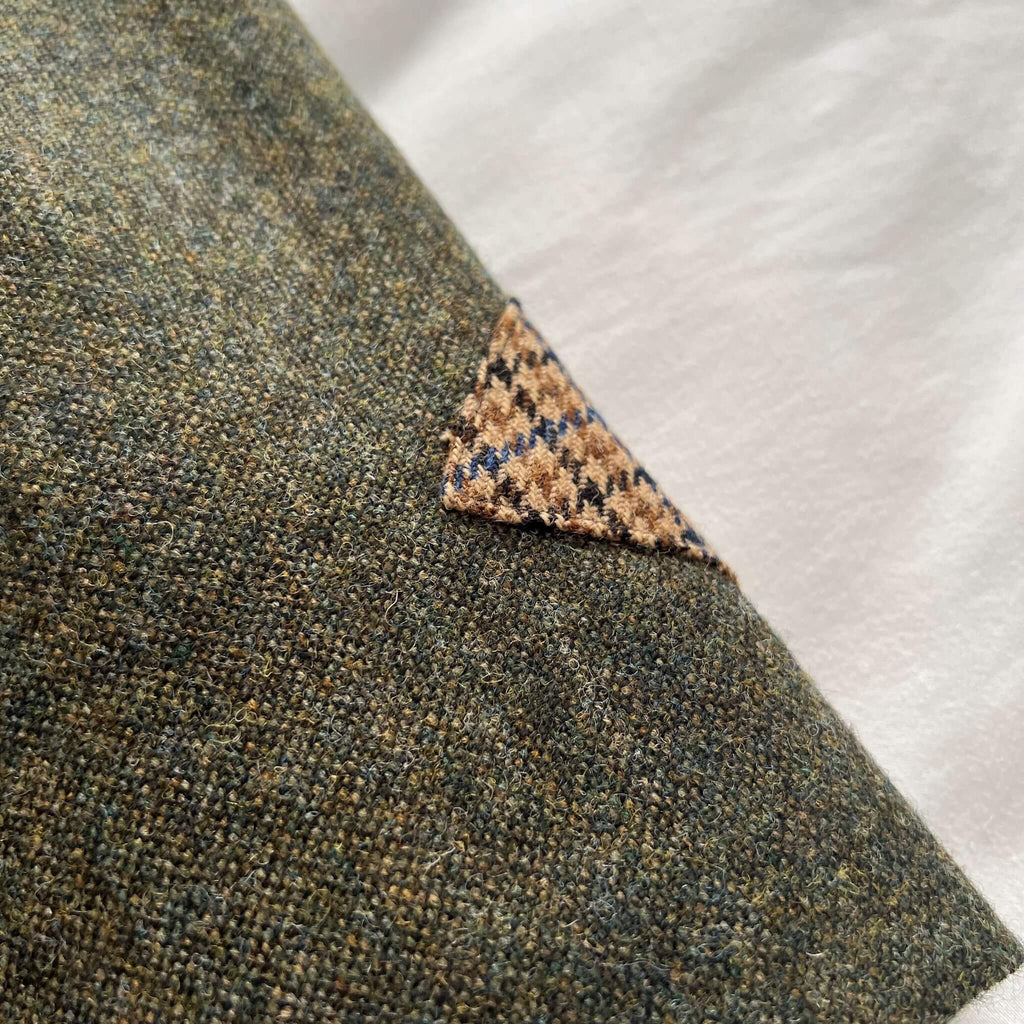 close up of green tweed skirt showing houndstooth trim detail