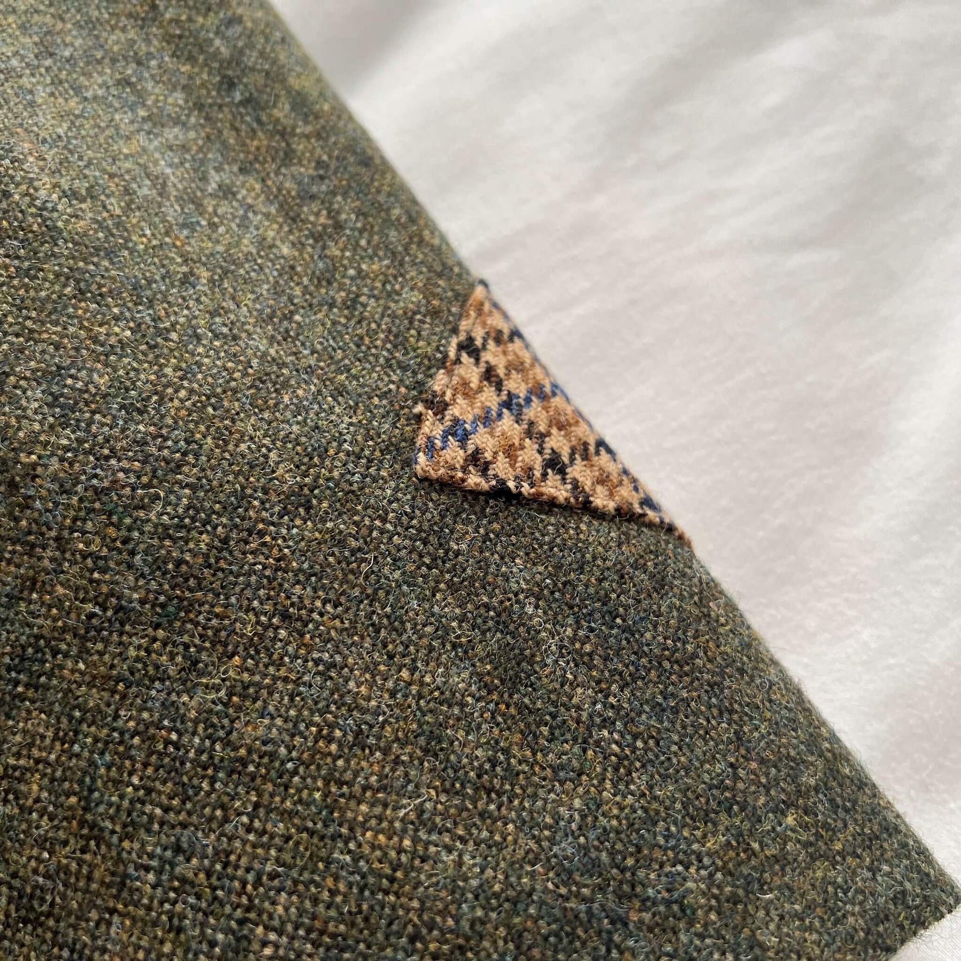 close up of green tweed skirt showing houndstooth trim detail