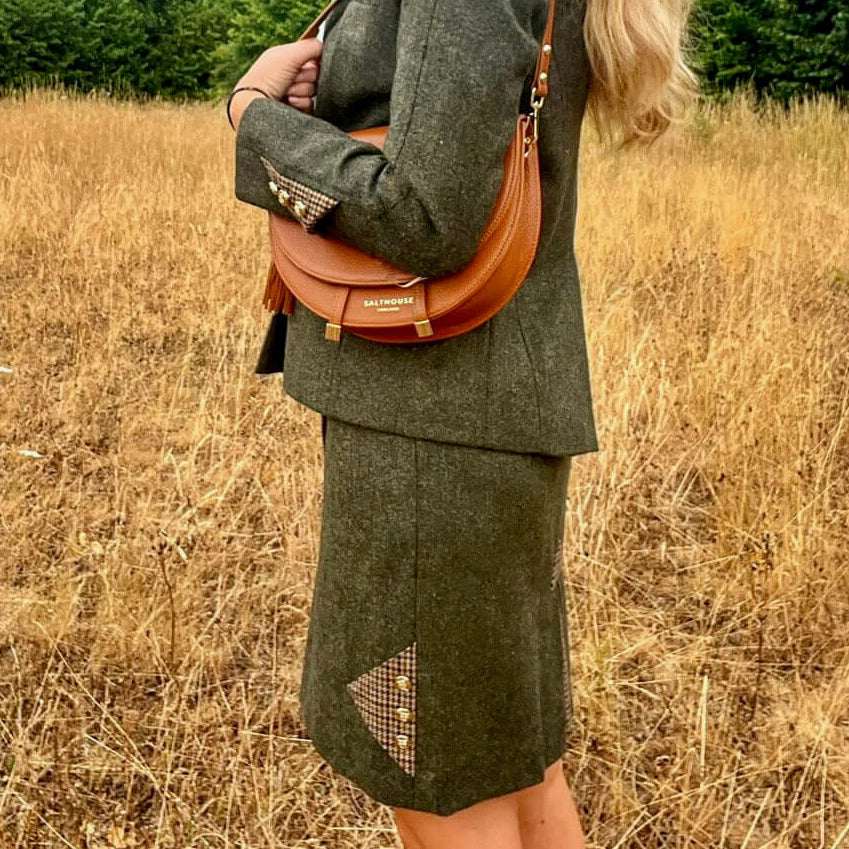 Adderbury green tweed skirt modelled with matching tweed jacket