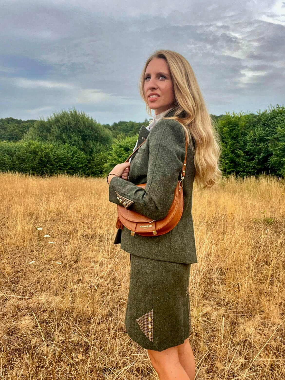 Adderbury green tweed skirt modelled with matching tweed jacket