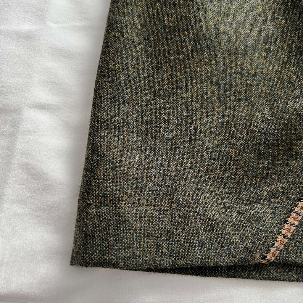 Close-up of the Adderbury green tweed skirt to show Shetland wool tweed pattern