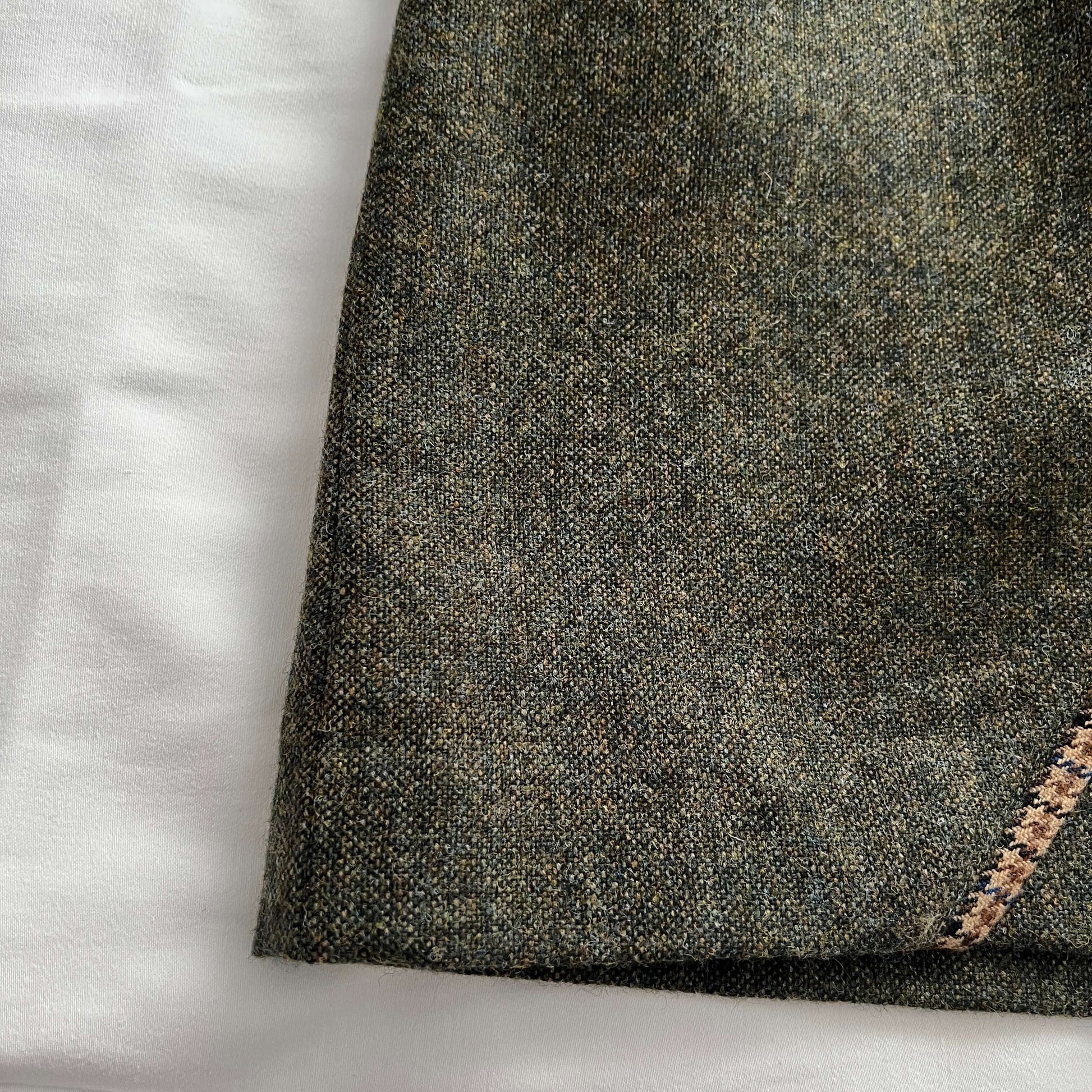 Close-up of the Adderbury green tweed skirt to show Shetland wool tweed pattern