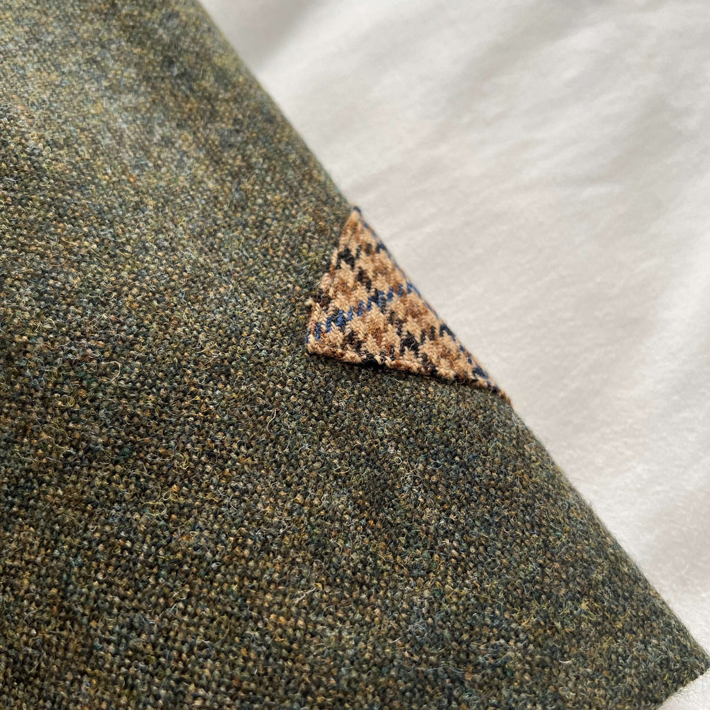 Close-up of the Adderbury skirt in Village Green, showing lambswool contrast trim