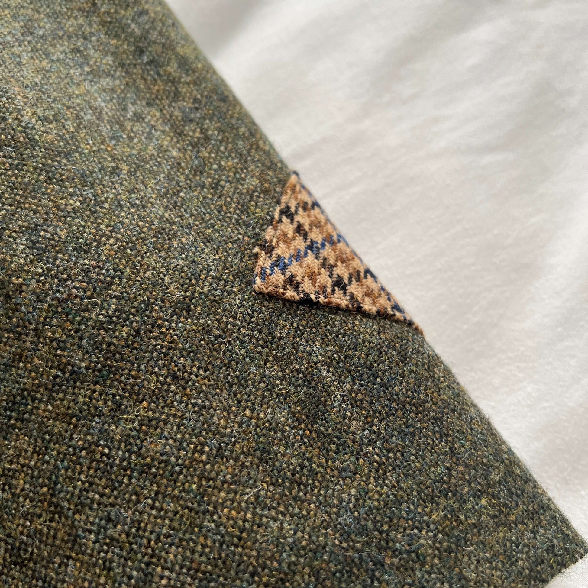 Close-up of the Adderbury skirt in Village Green, showing lambswool contrast trim