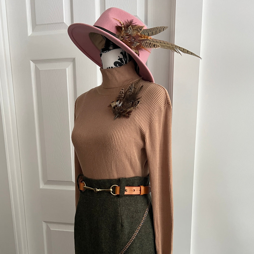 Tan brown equestrian horse bit belt styled with tweed, feathers and a jumper for autumn