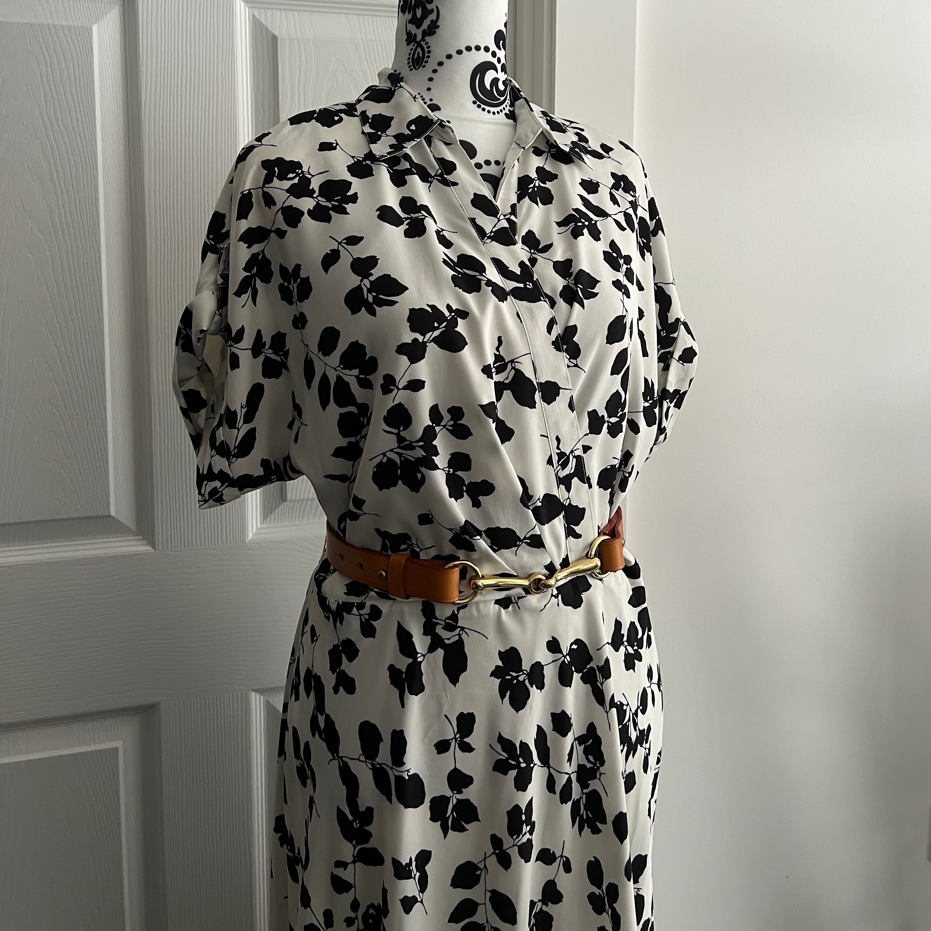 Tan brown equestrian horse bit belt styled with a long dress for summer occasions