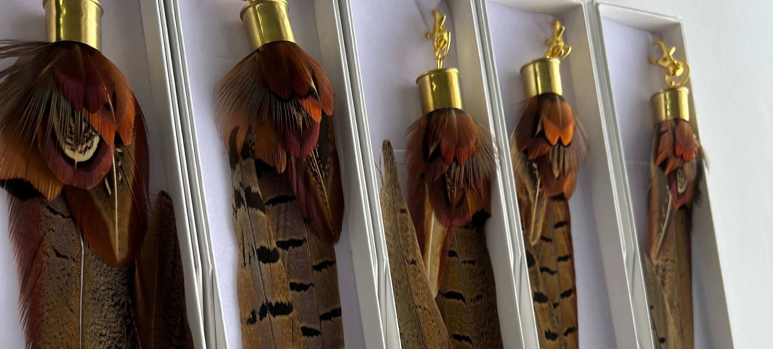 set of feather boot tassels in gift boxes