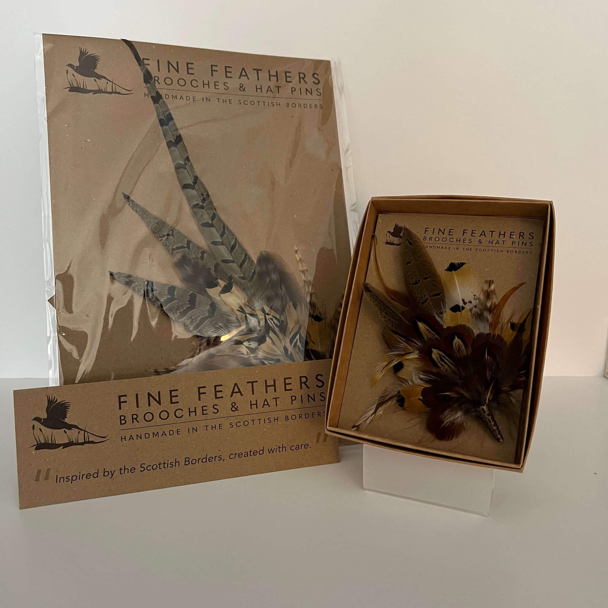 Fine Feathers large hat pin and small brooch pin boxed