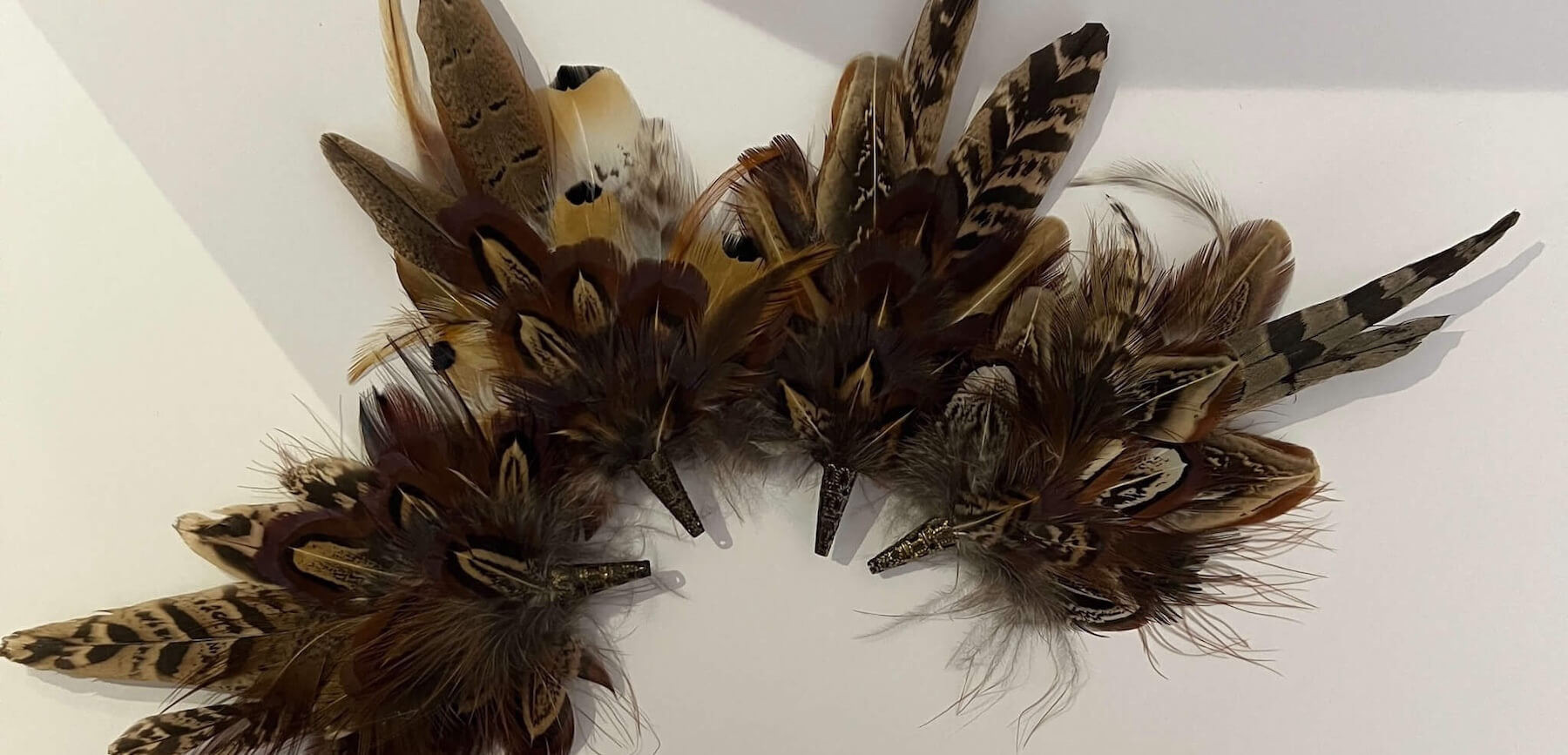 set of small feather hat brooch pins