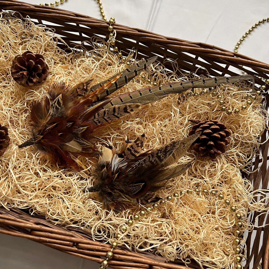 Christmas hamper basket with a feather hat pin and brooch pin