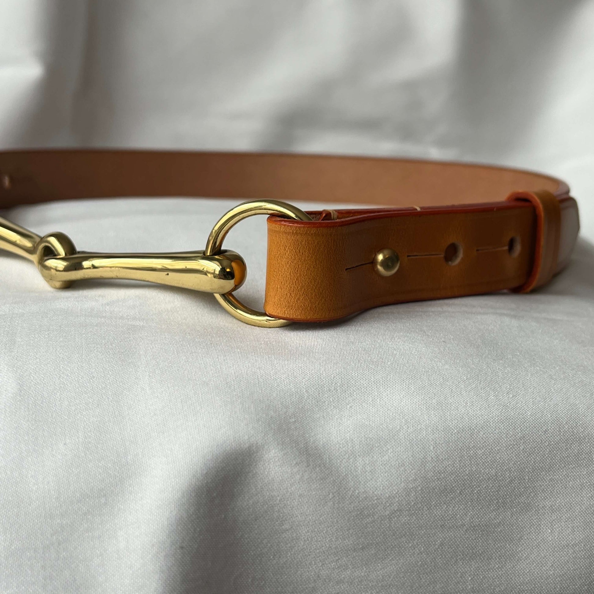 Tan handmade bridle leather equestrian belt close-up