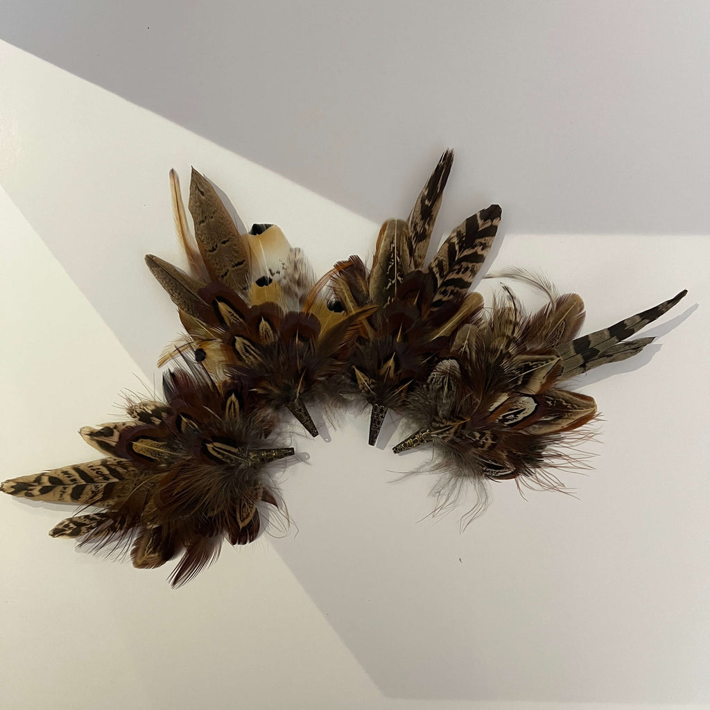 Selection of feather brooches by Fine Feathers Design