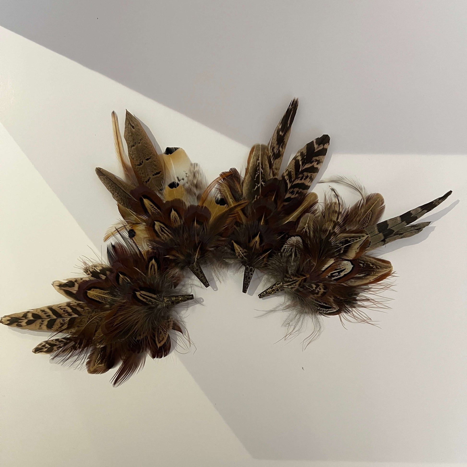 Selection of feather brooches by Fine Feathers Design
