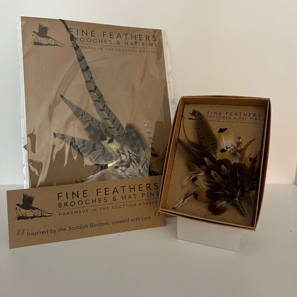 feather hat pin and feather brooch by Fine Feathers Design