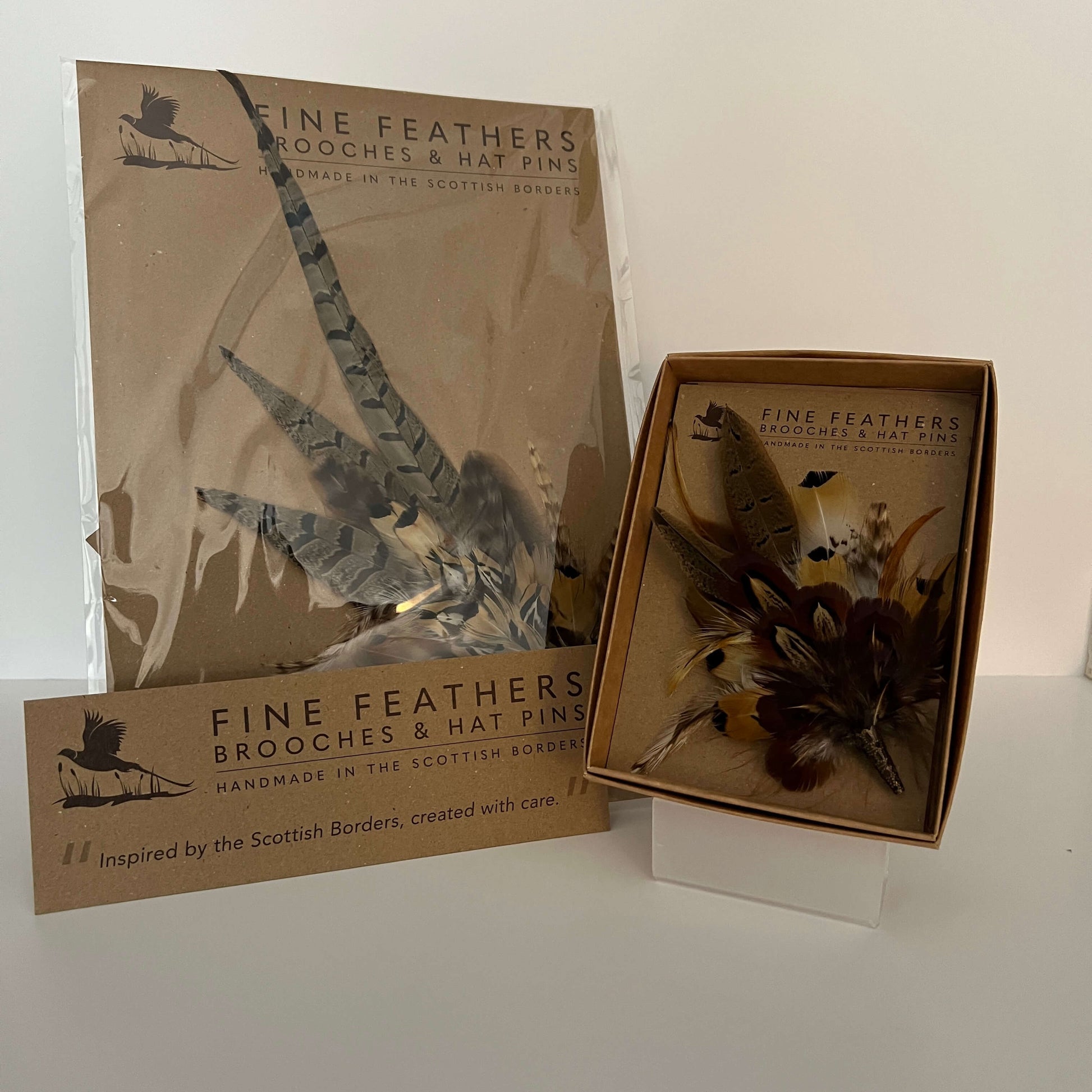 feather hat pin and feather brooch by Fine Feathers Design