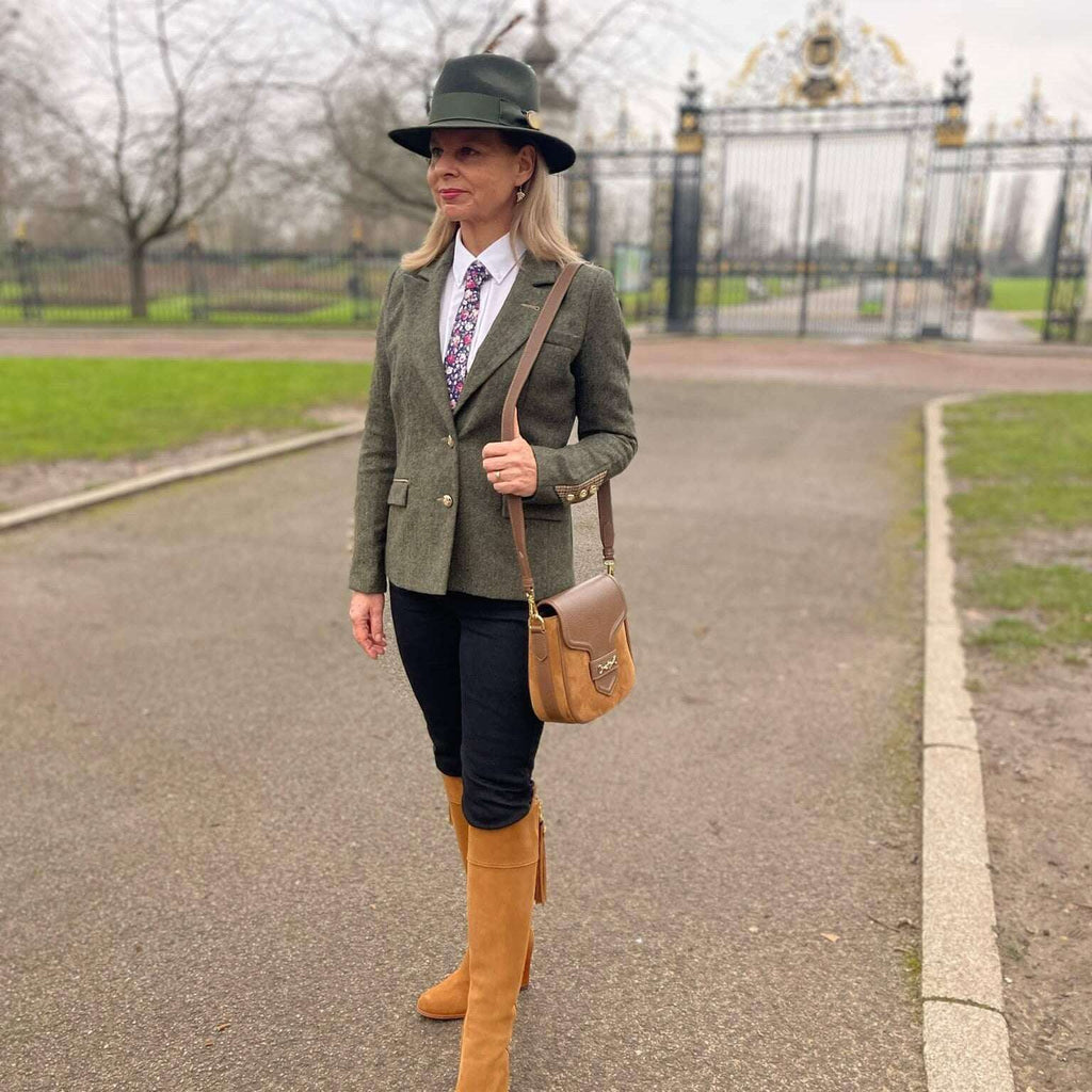 English Nettle Heyford tweed jacket in green, styled with navy trousers and tan boots