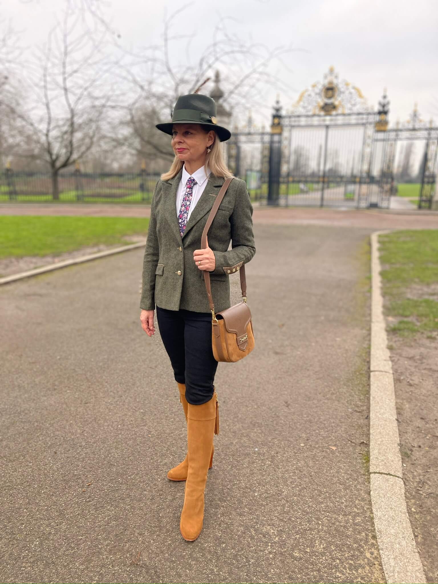 English Nettle Heyford tweed jacket in green, styled with navy trousers and tan boots