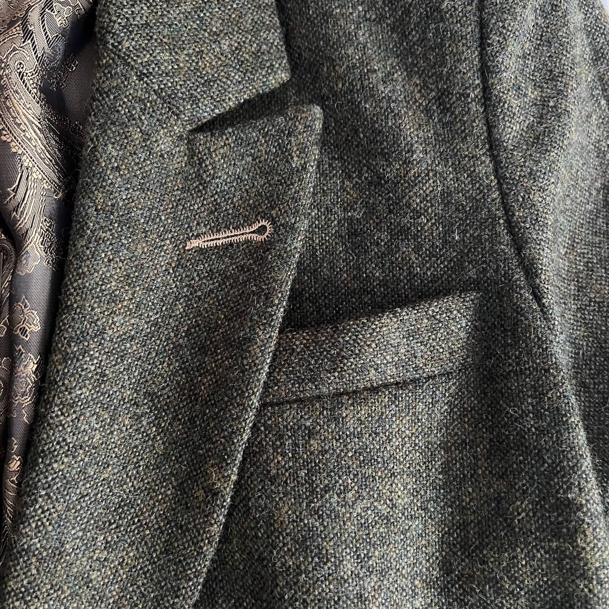 close up of green tweed jacket lapel