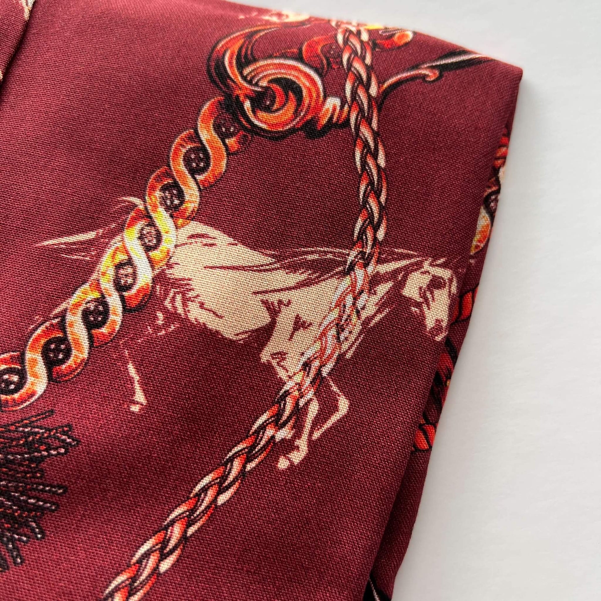red horse print shirt detail