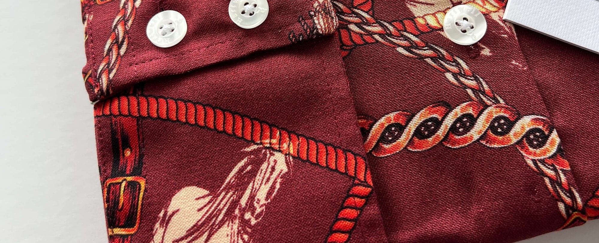 red horse print shirt detail