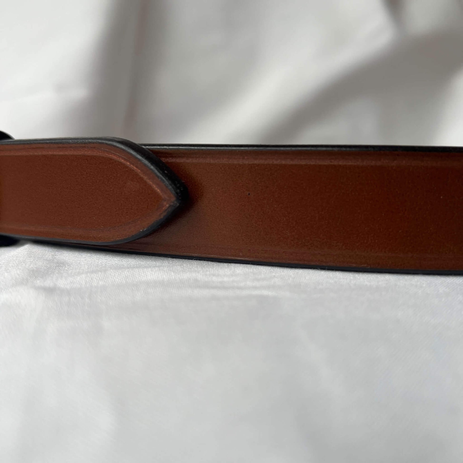 close up of farm traced english bridle leather ladies' skinny leather belt