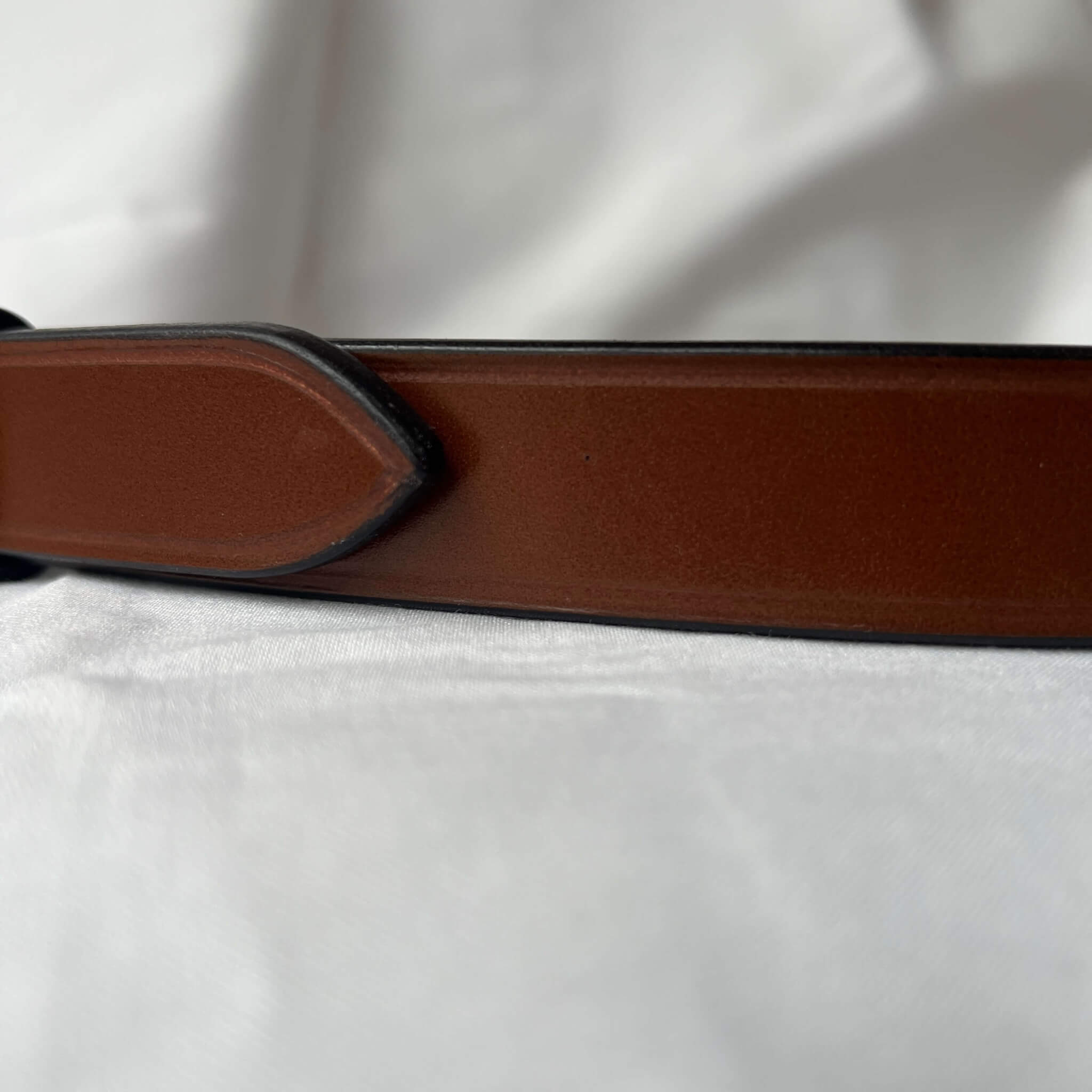 close up of farm traced english bridle leather ladies' skinny leather belt