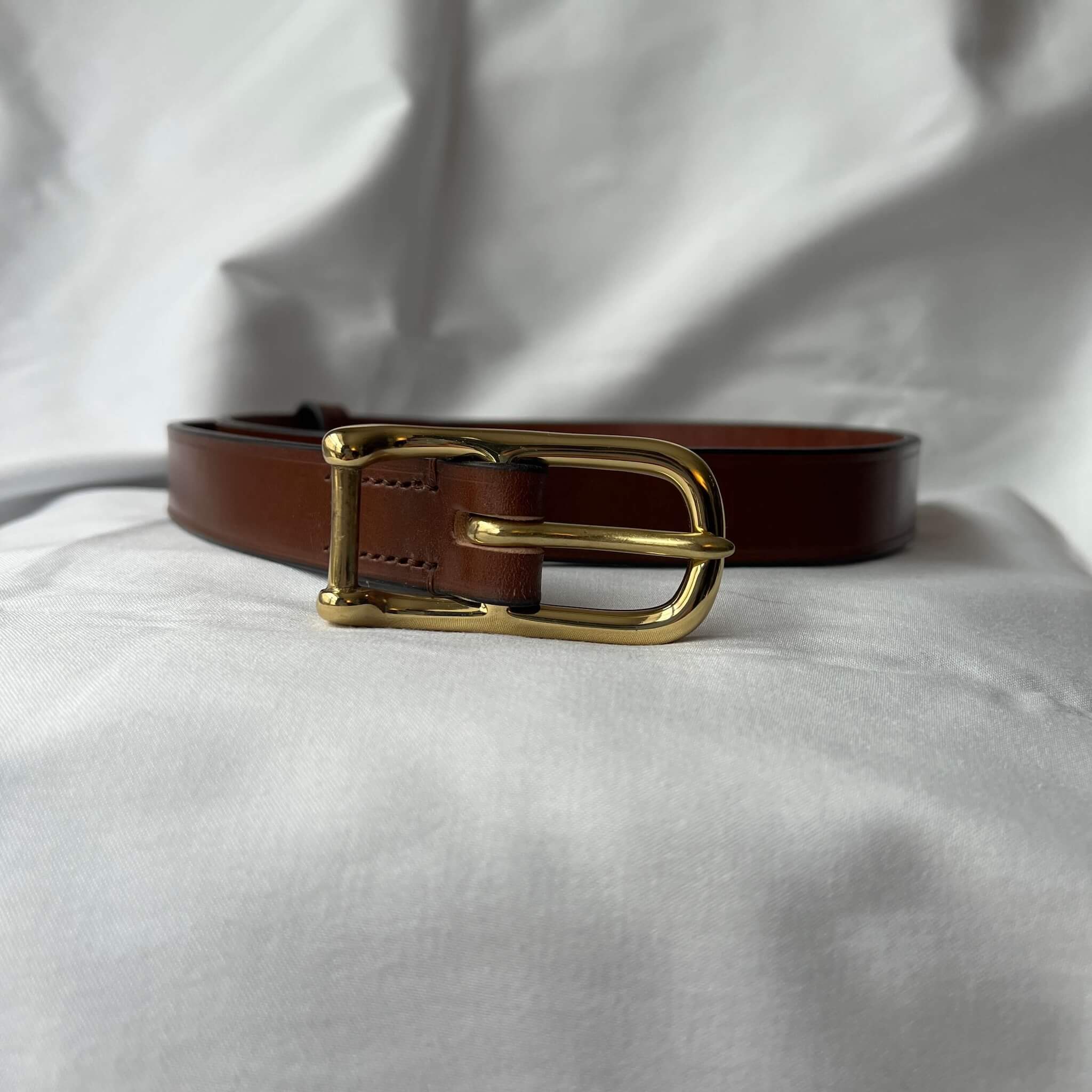brown leather skinny belt showing buckle in open position