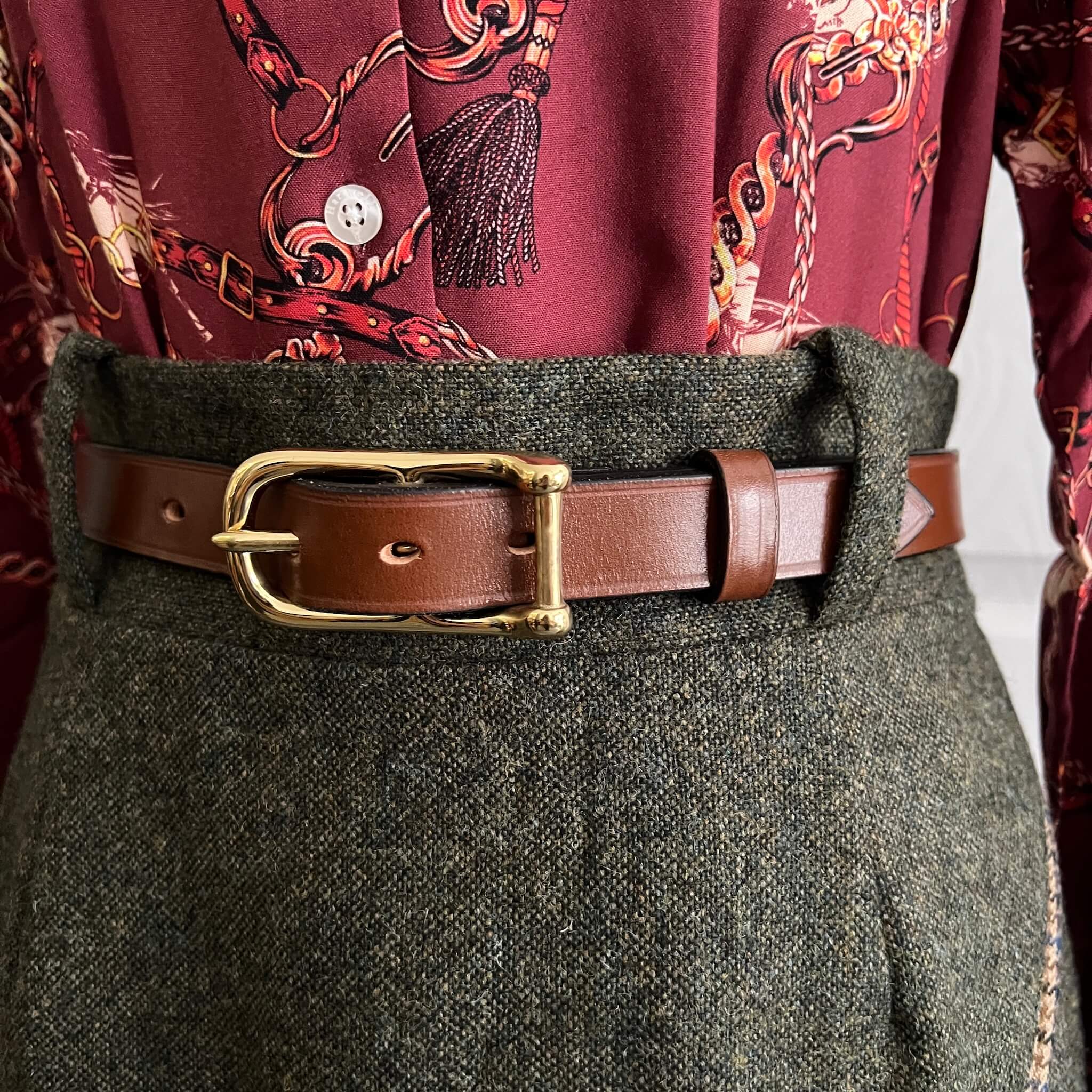 green tweed skirt worn with brown handmade bridle leather belt