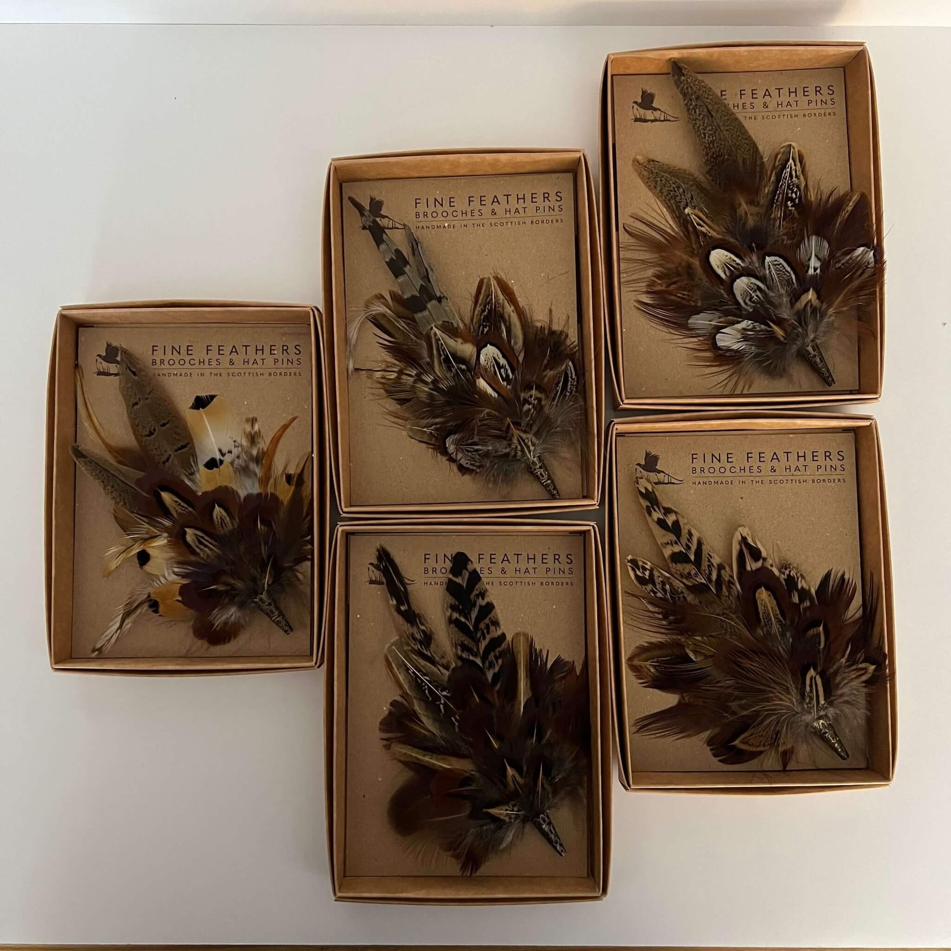 set of small feather brooch hat pins boxed