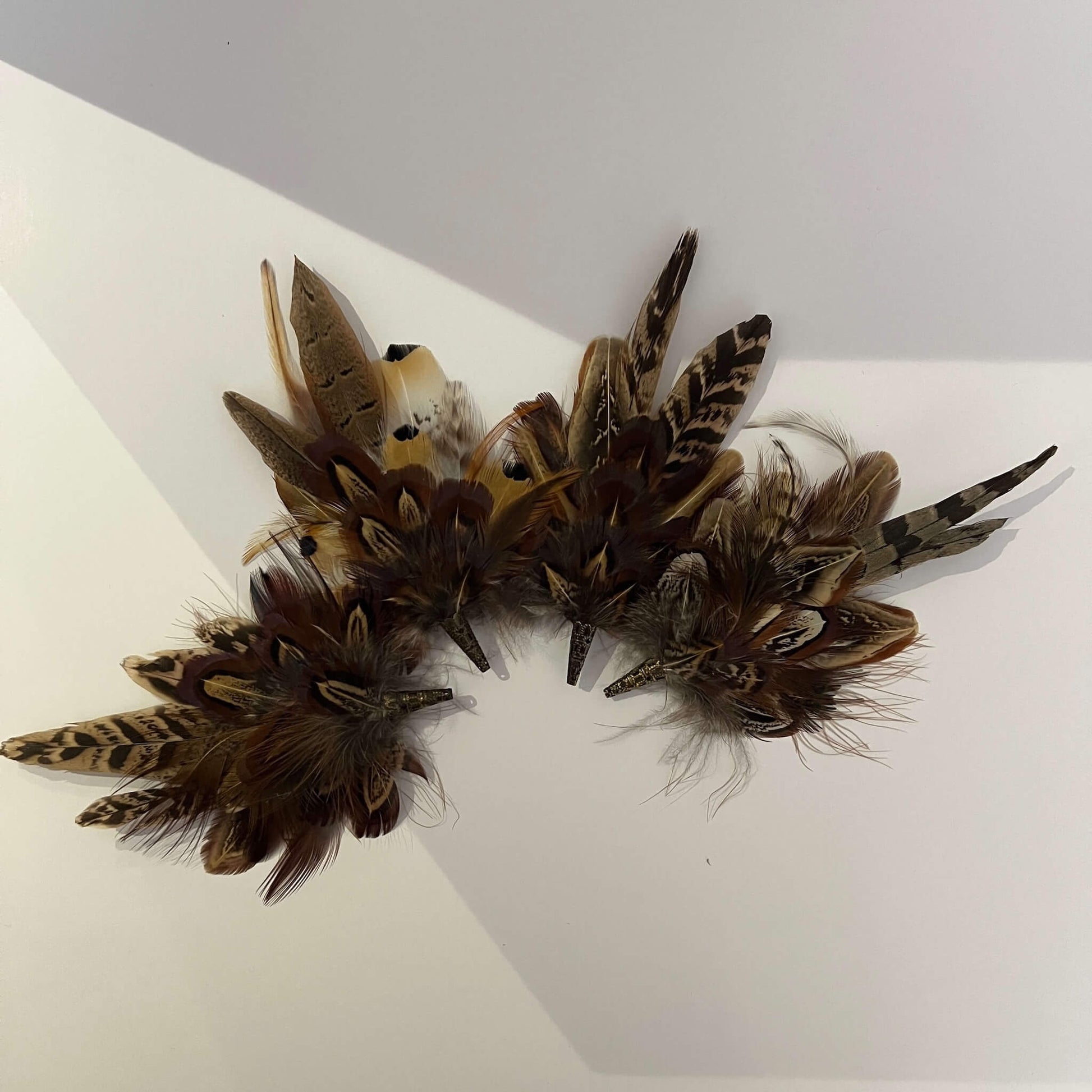 set of small feather brooch or hat pins