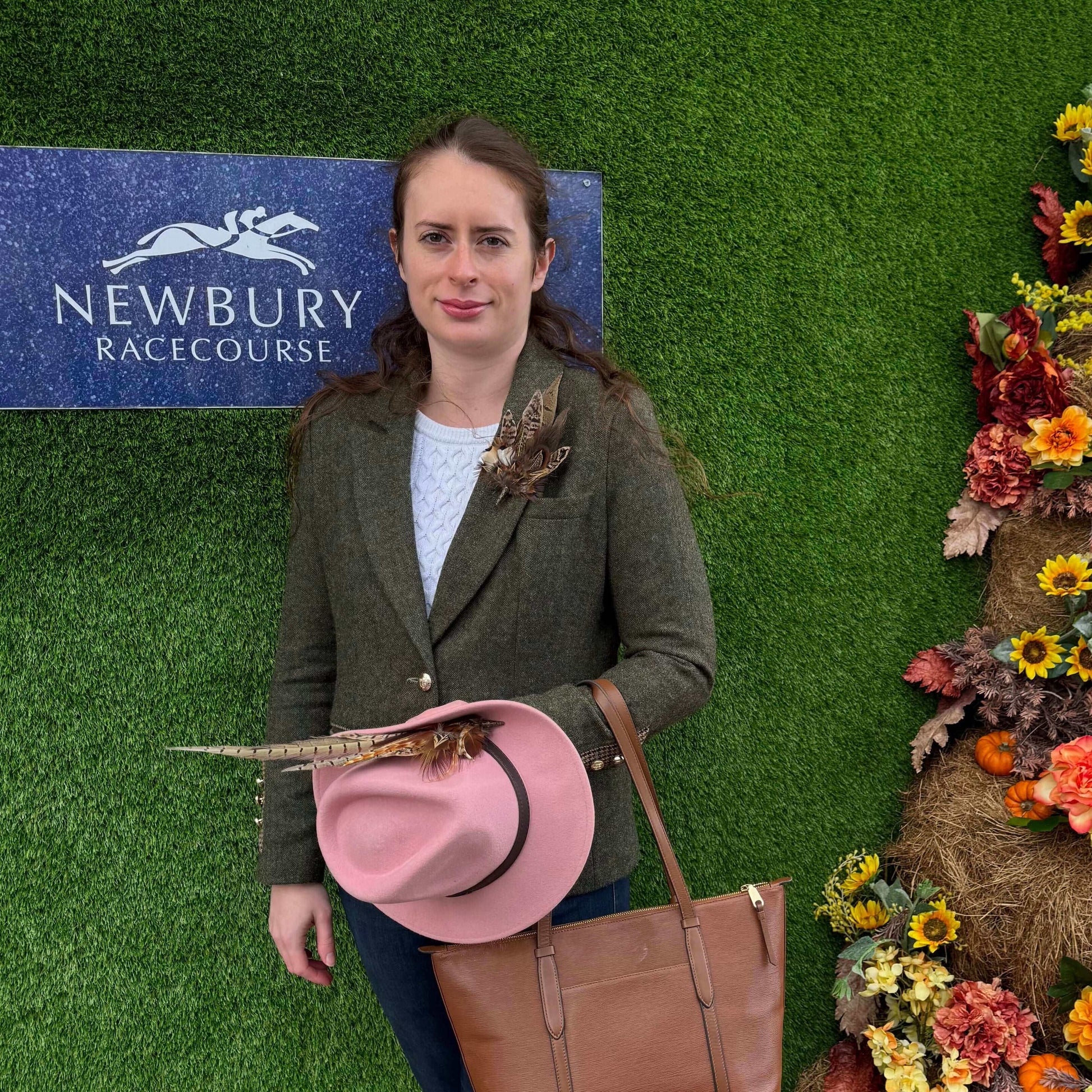 Ladies jumps racing outfit with green tweed jacket, feather hat pin and feather brooch pin